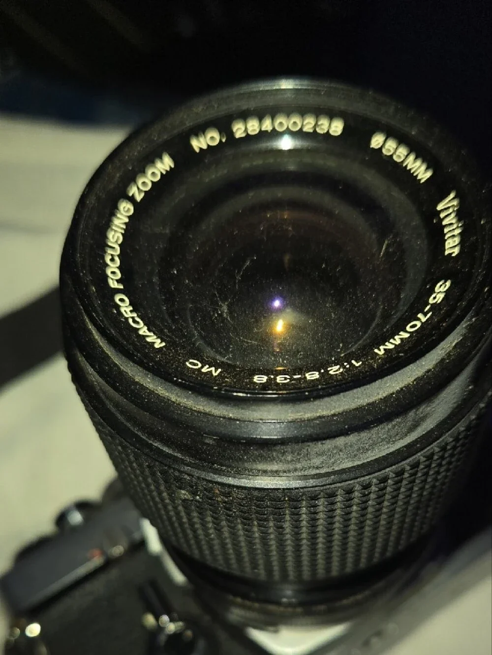 Olympus OM-1 Silver and Black Film SLR with Black Zoom Lens